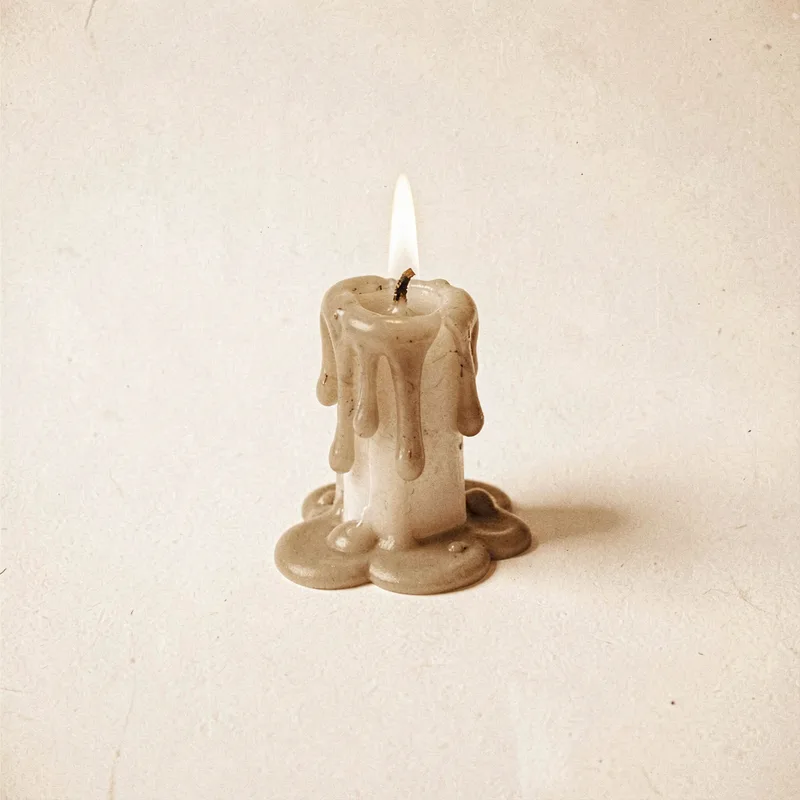 A half-melted candle stub with dripping wax