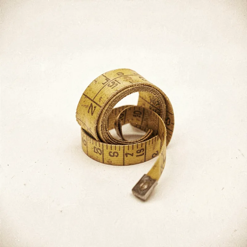 A curled cloth tape measure